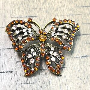 Butterfly Brooch, NIP, colored rhinestones on a dark golden base, great gift